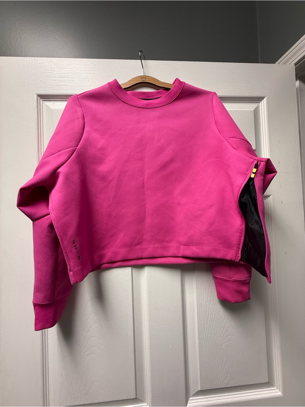 Nike Tech Pack sweatshirt in a vibrant pink color